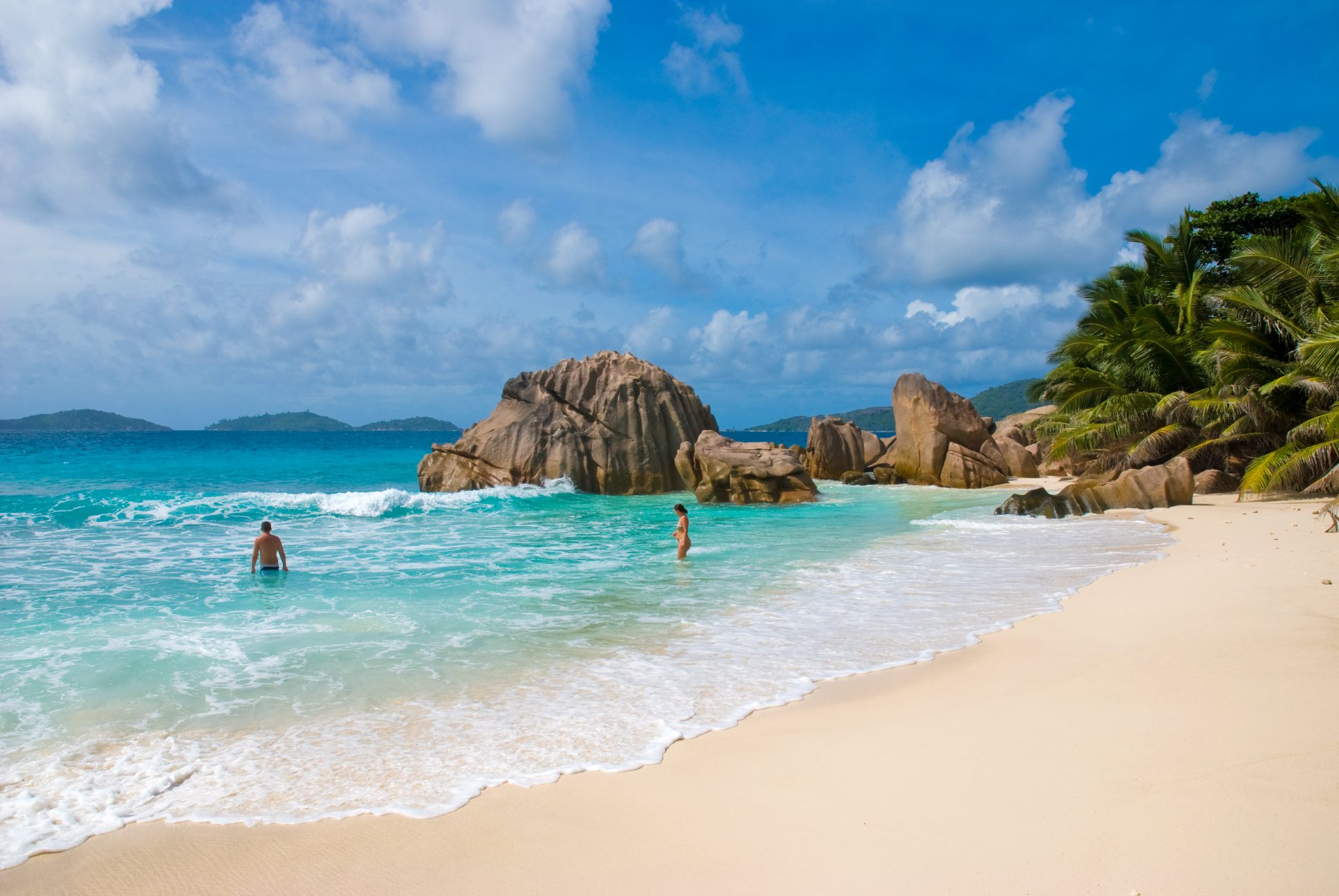 Couple enjoying the beach in La Digue, Seychelles | Just Seychelles