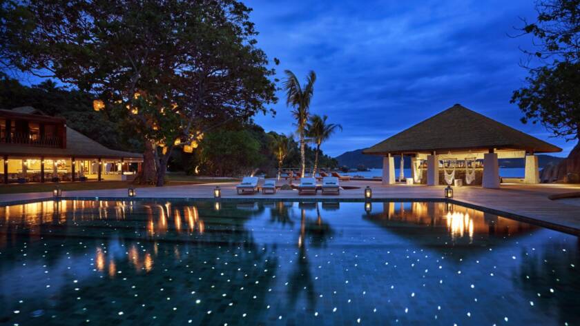 The main pool at night, Six Senses Zil Pasyon | Just Seychelles