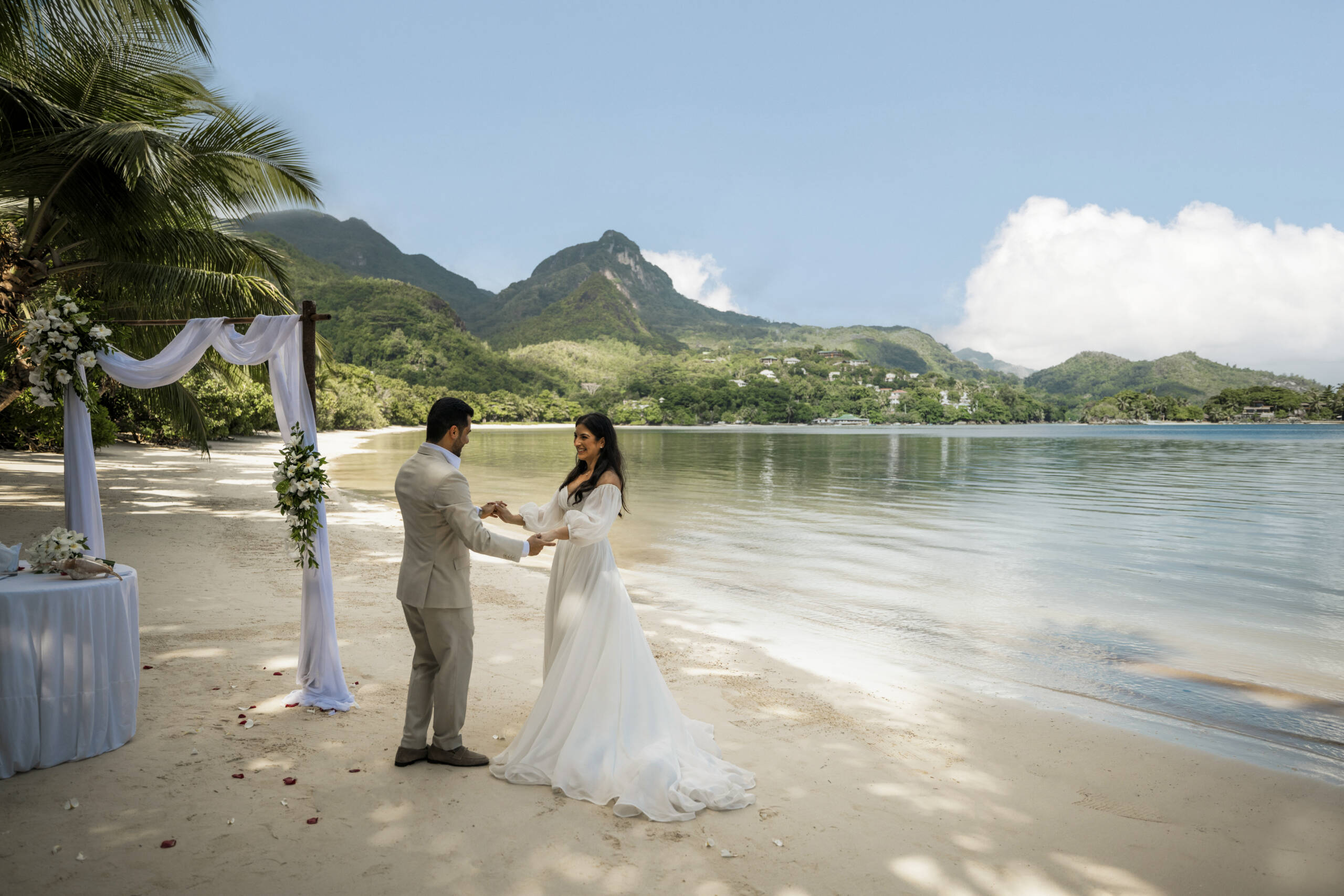 Couple getting married on the beach at Constance Ephelia | Just Seychelles