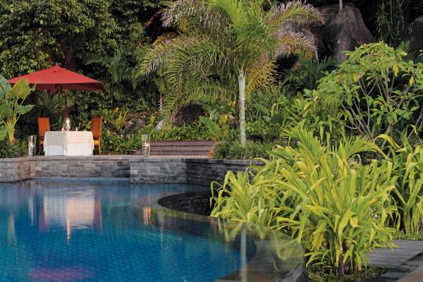 Dining by the main pool at Anantara Maia Seychelles Villas, Mahé | Just Seychelles