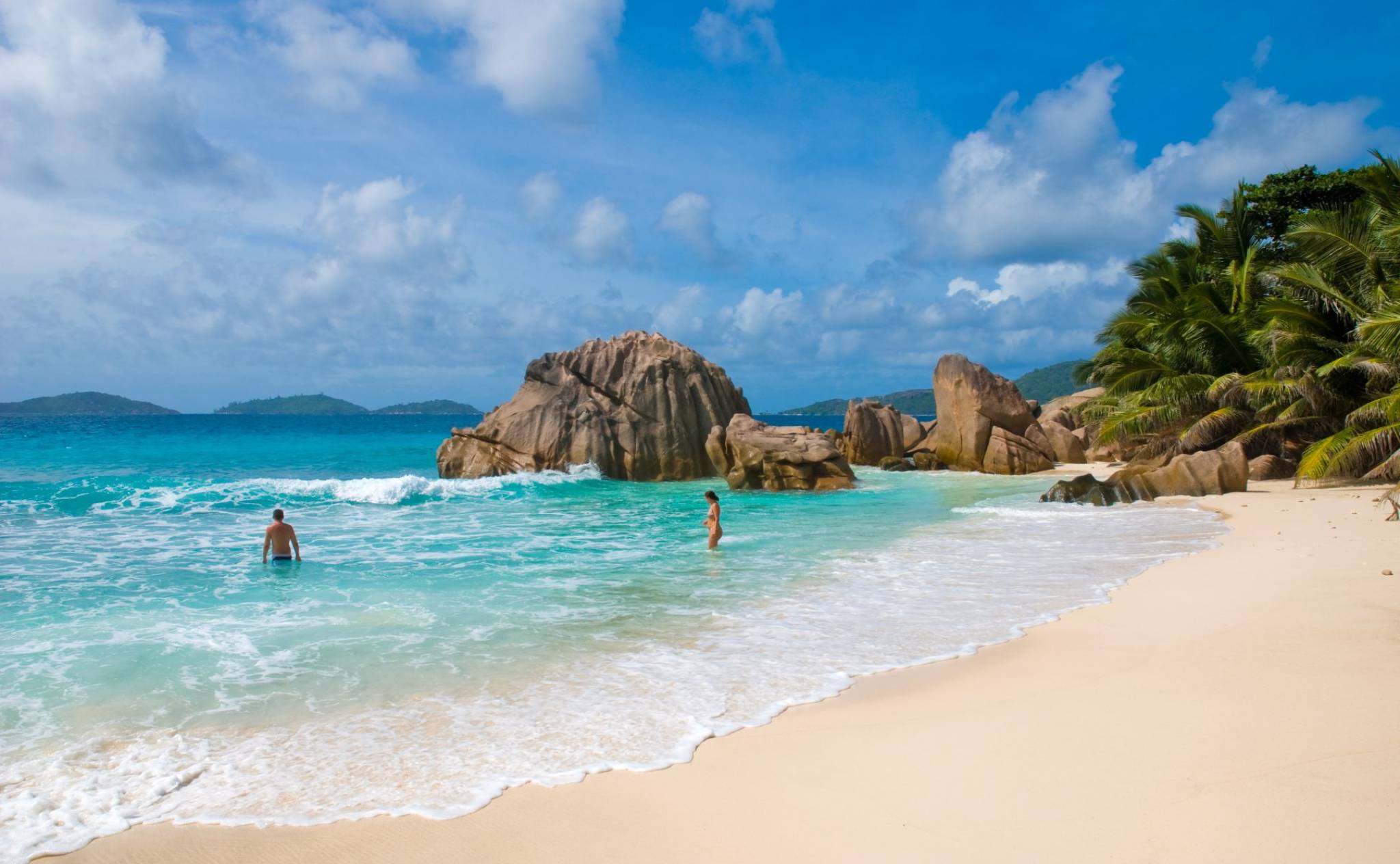Couple enjoying the beach in La Digue, Seychelles | Just Seychelles