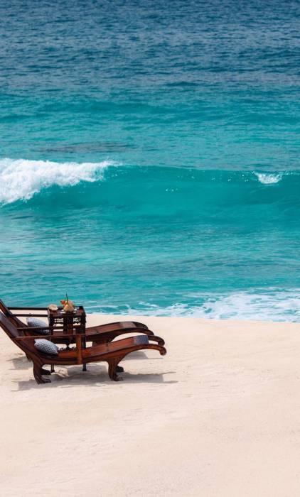Sun loungers on the beach at Cousin Island | Just Seychelles