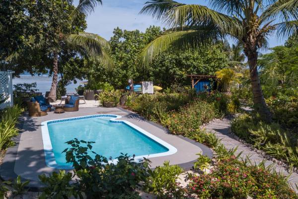 Pool area and garden at Le Repaire Boutique Hotel, La Digue | Just Seychelles