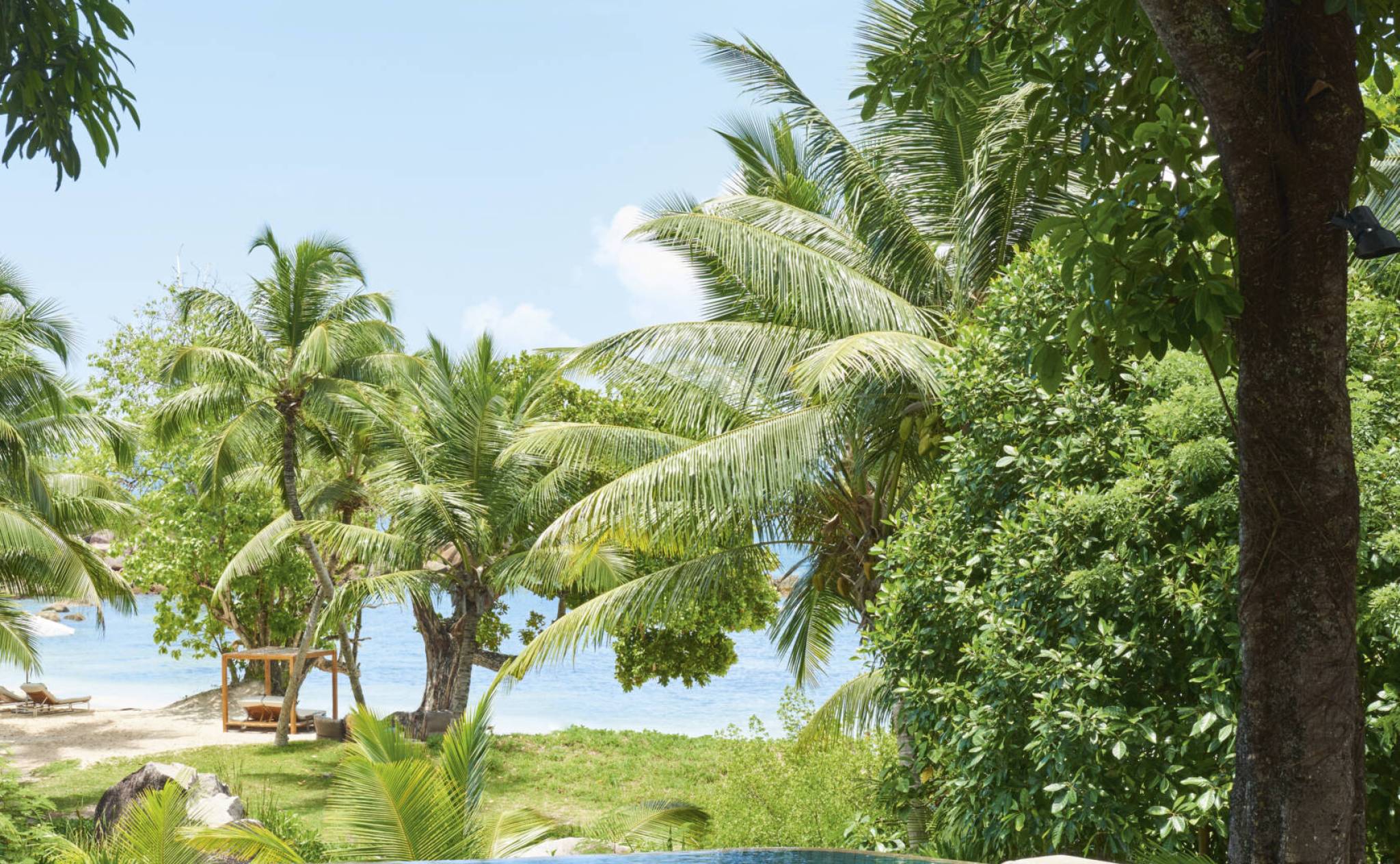 Dining by the main pool at Constance Lemuria, Praslin | Just Seychelles