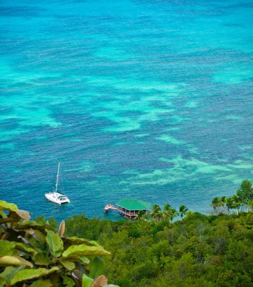 Aerial view of sailing boat in Praslin | Just Seychelles